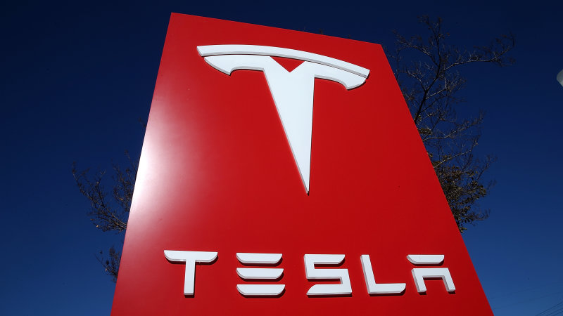 Tesla quarterly earnings fall short, but it posts first-ever annual profit